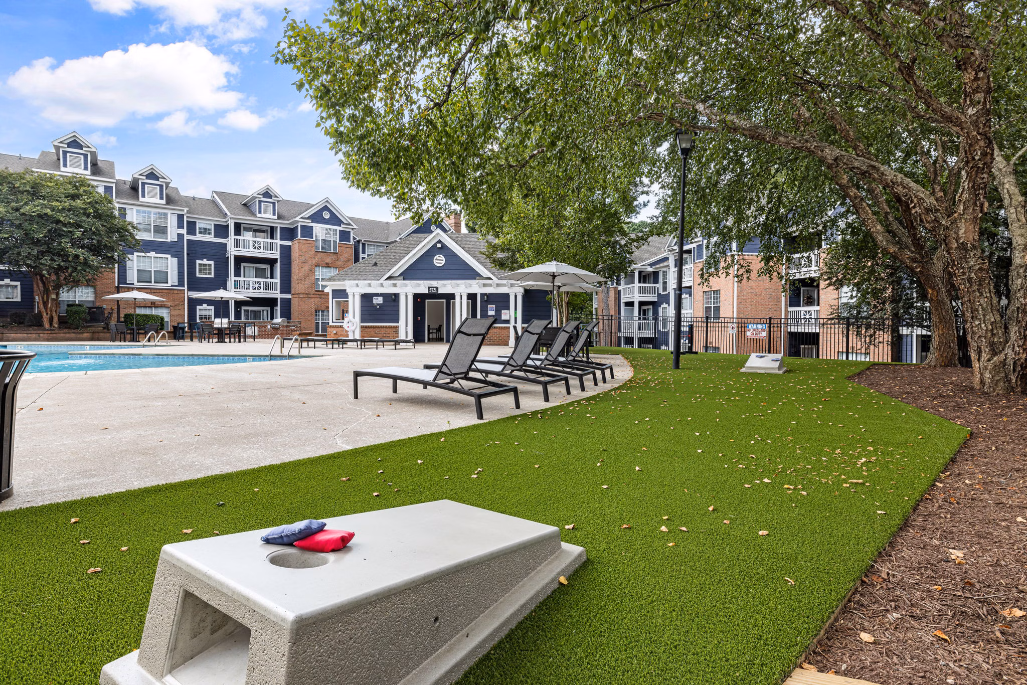 Serene courtyard with landscaped gardens at Mariners Crossing Apartments