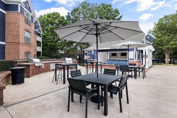 Outdoor grilling area with modern grills at Mariners Crossing Apartments