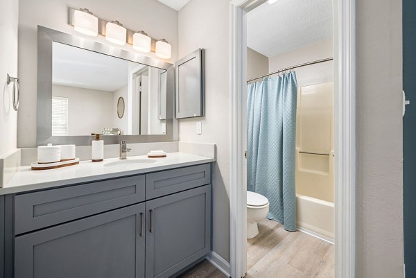 Modern bathroom with dual vanities in View at Lake Lynn Apartments