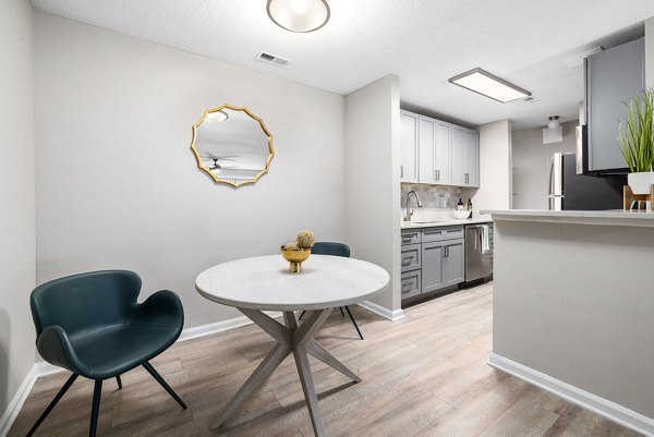 Elegant dining area with modern decor and natural light in View at Lake Lynn Apartments