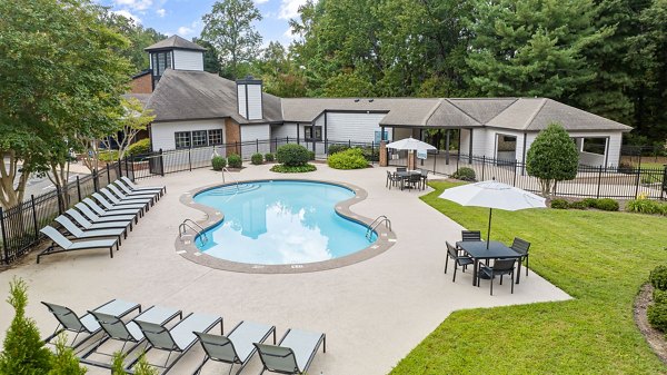 Resort-style pool with lounge seating at View at Lake Lynn Apartments