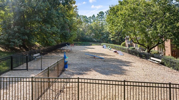 Spacious dog park with agility equipment at View at Lake Lynn Apartments Warm, pet-friendly environment perfect for apartment residents and their furry friends