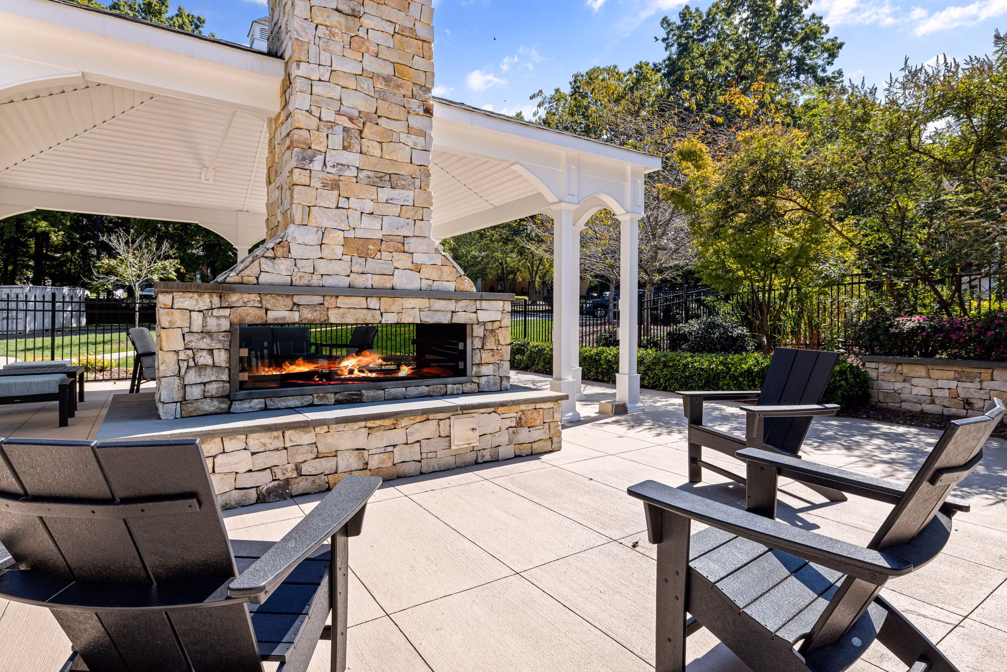Fire pit area with cozy seating at View at Lake Lynn Apartments, providing a relaxing outdoor amenity for social gatherings