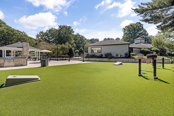 Courtyard with lush gardens and seating at View at Lake Lynn Apartments