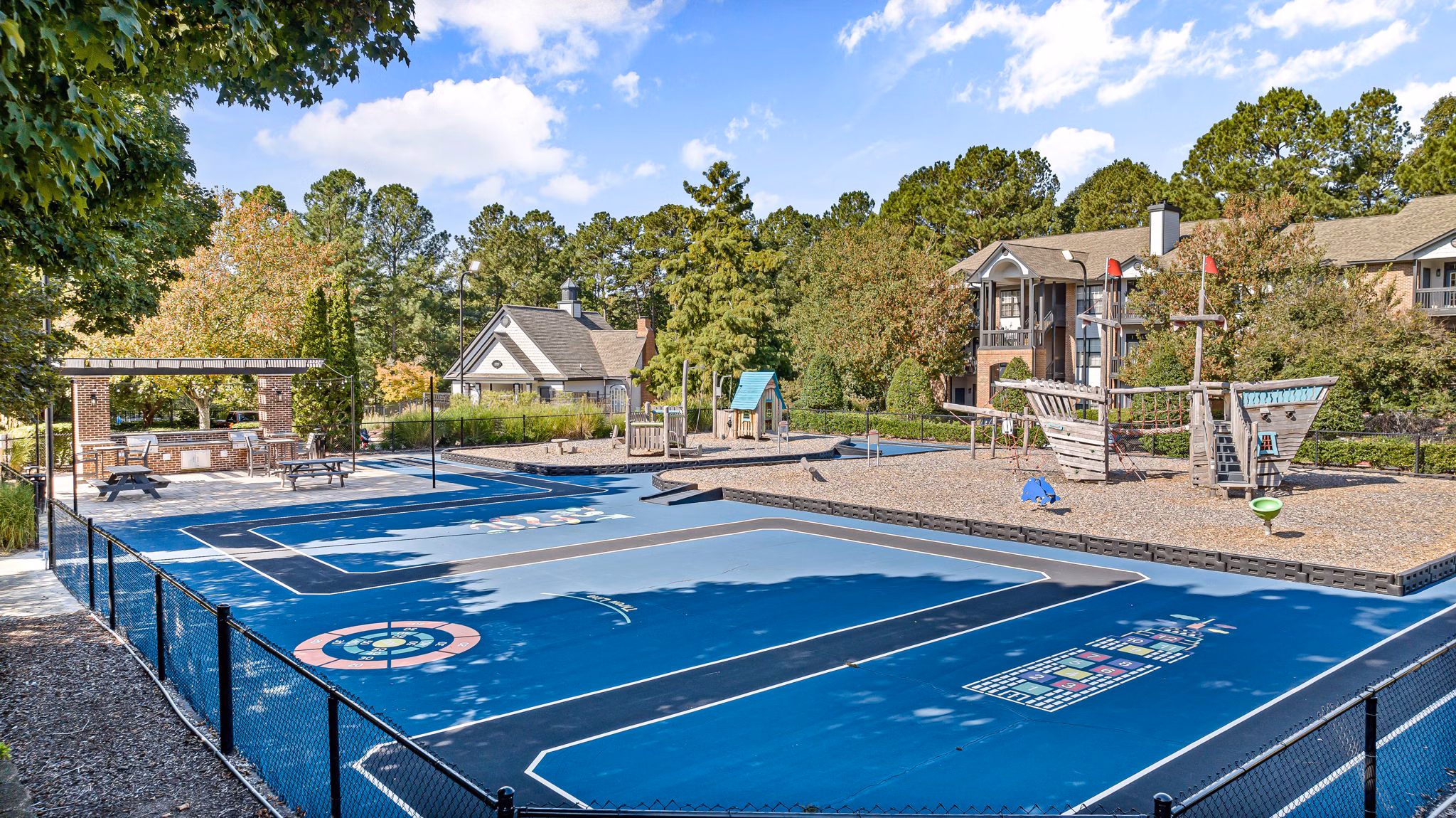 Sports court with lush surroundings at View at Lake Lynn Apartments, offering recreational opportunities