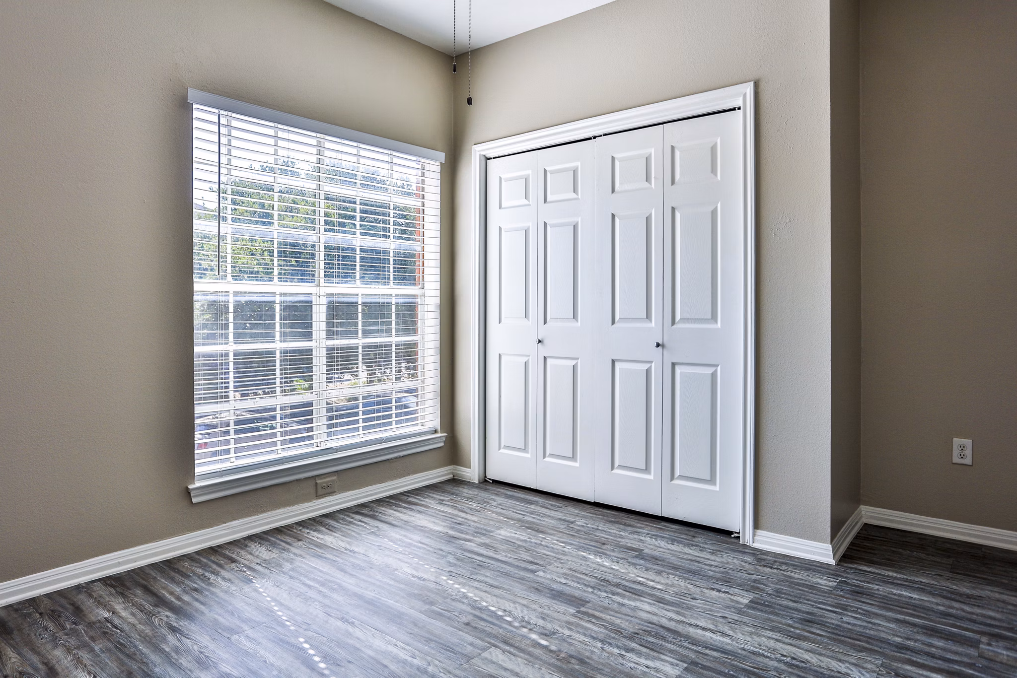 Cozy bedroom with modern furnishings at The Quarry Alamo Heights Apartments