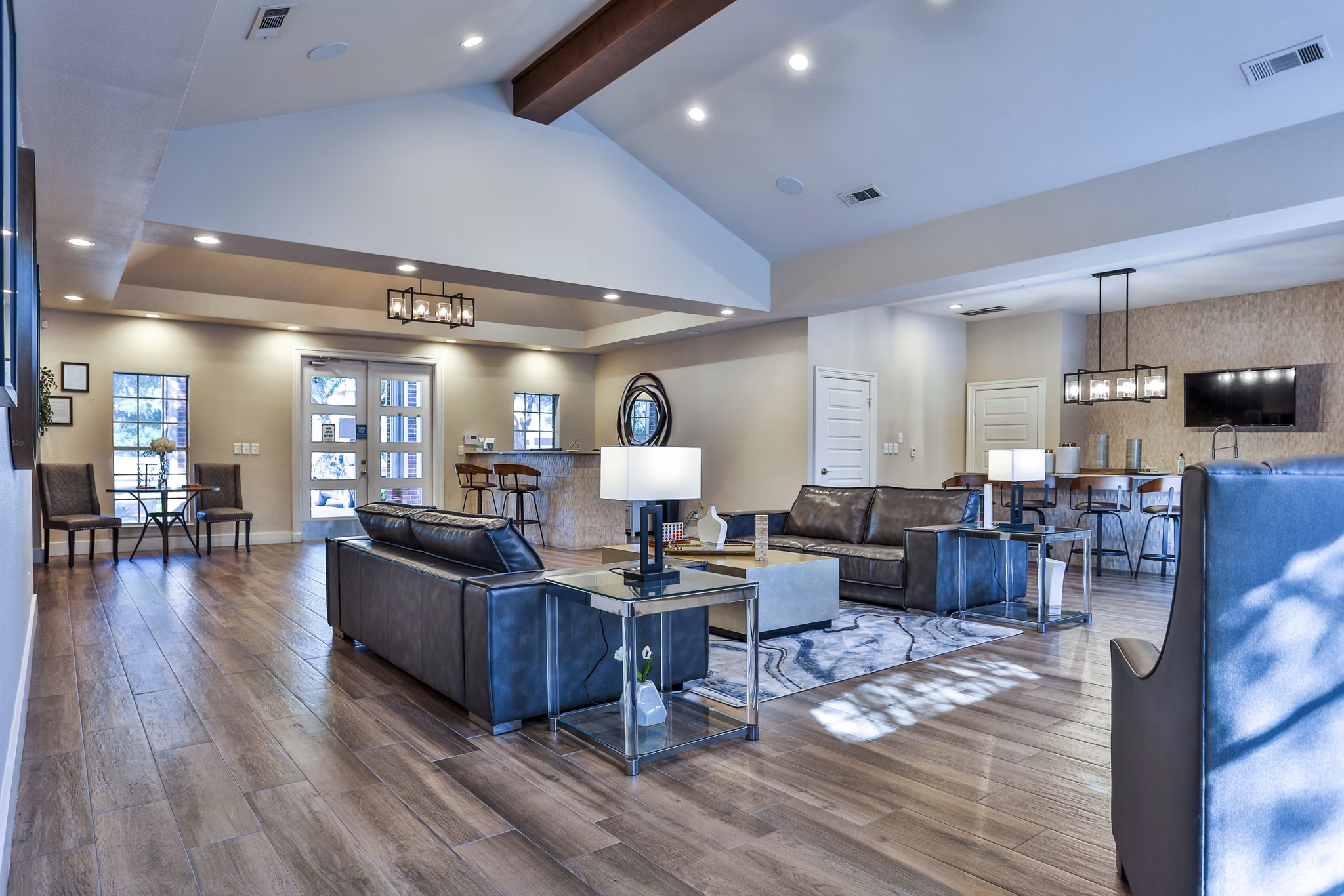 The Quarry Alamo Heights Apartments: Elegant clubhouse lobby featuring modern decor and ample seating