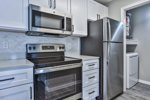Modern kitchen featuring stainless steel appliances at The Quarry Alamo Heights Apartments in Alamo Heights