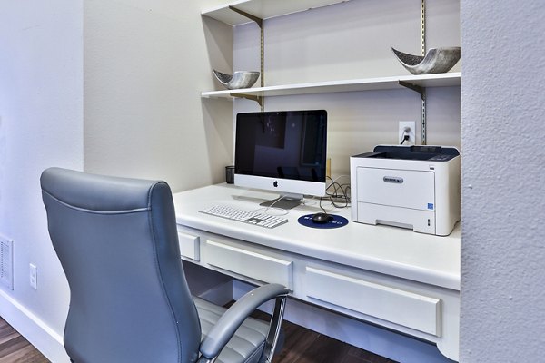 Home office area with modern design and ergonomic desk in The Quarry Alamo Heights Apartments, ideal for luxury work-from-home living