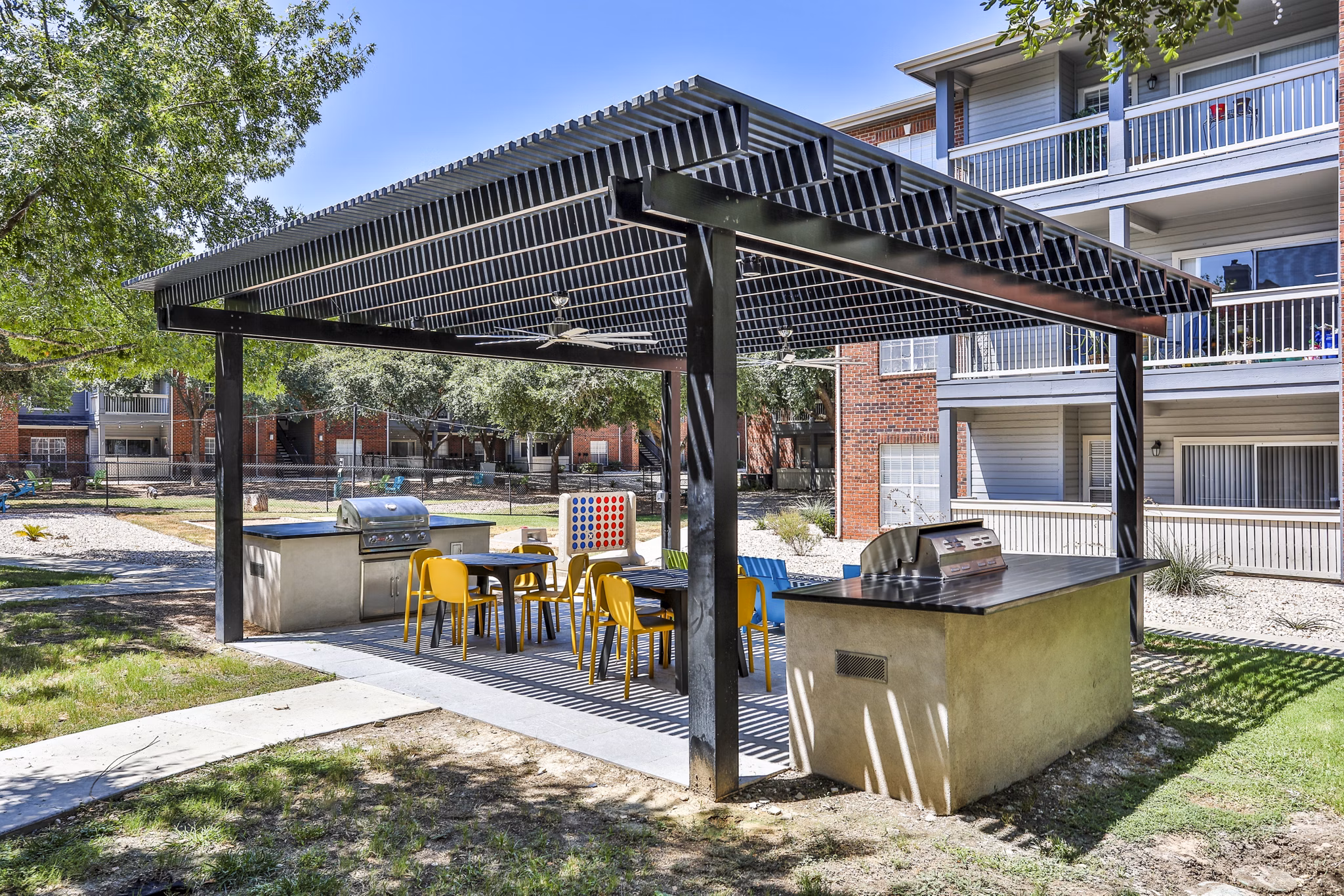 Outdoor grill area on a spacious patio at The Quarry Alamo Heights Apartments, perfect for entertaining and relaxation