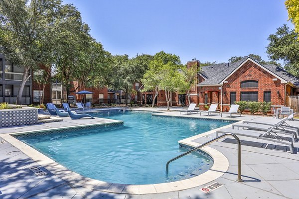 Resort-style swimming pool at The Quarry Alamo Heights Apartments, perfect for lounging and relaxation in a luxury community setting