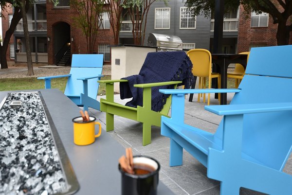 Cozy outdoor fire pit area at The Quarry Alamo Heights Apartments, ideal for social gatherings and relaxation in luxury surroundings