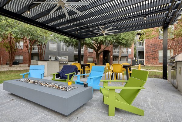 Courtyard with lush landscaping at The Quarry Alamo Heights Apartments, showcasing a serene outdoor space for relaxation and socializing