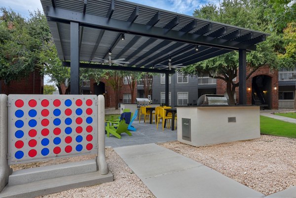 Courtyard with lush landscaping at The Quarry Alamo Heights Apartments, offering luxury living in San Antonio