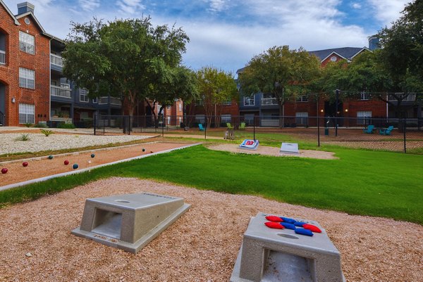 Courtyard with lush landscaping at The Quarry Alamo Heights Apartments, offering a serene outdoor retreat for residents