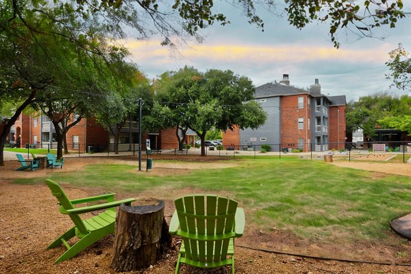 Courtyard with lush gardens at The Quarry Alamo Heights Apartments offering luxury amenities in serene setting