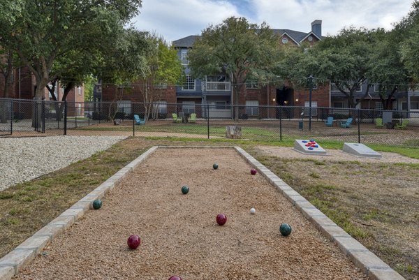 Courtyard with lush greenery at The Quarry Alamo Heights Apartments, offering a peaceful outdoor retreat for residents