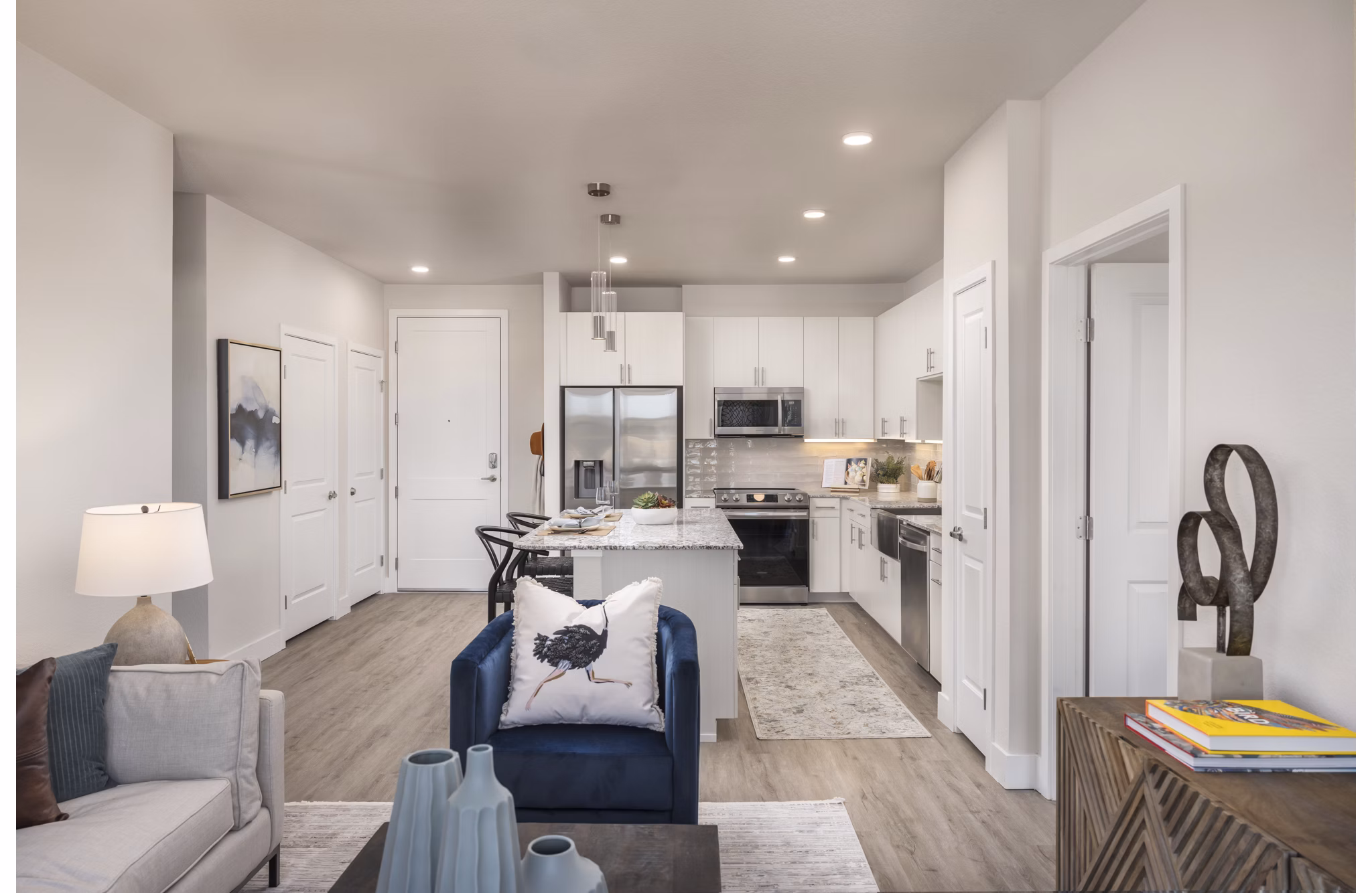 Living room featuring modern furniture and natural light at Alexan Montview Plaza Apartments