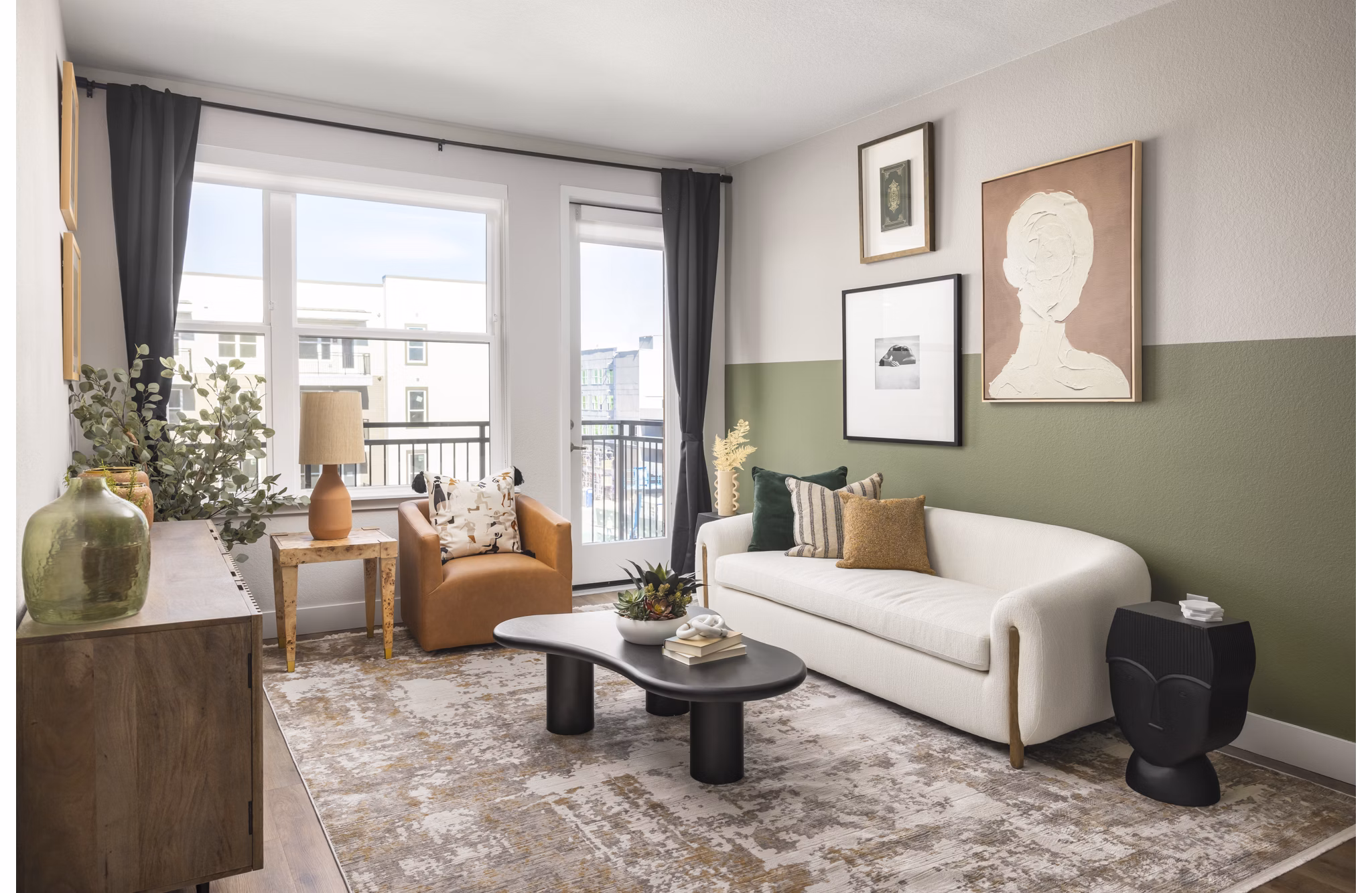 Bright, open-concept living room with modern furnishings at Alexan Montview Plaza Apartments, offering luxurious city living