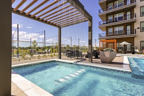 Rooftop pool with city views at Alexan Montview Plaza Apartments