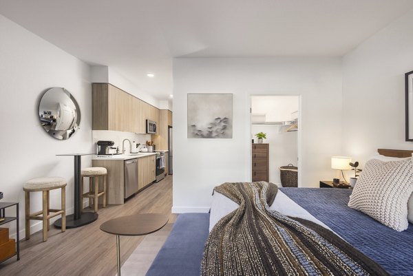 Cozy bedroom with elegant furnishings at Forge Apartments, offering luxurious living in a premier location