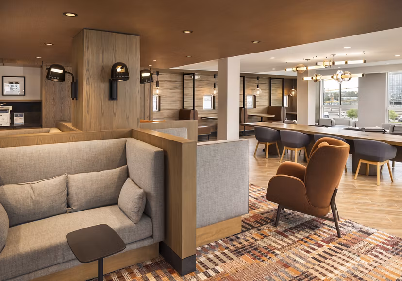 Spacious clubhouse featuring modern design and cozy seating at Forge Apartments