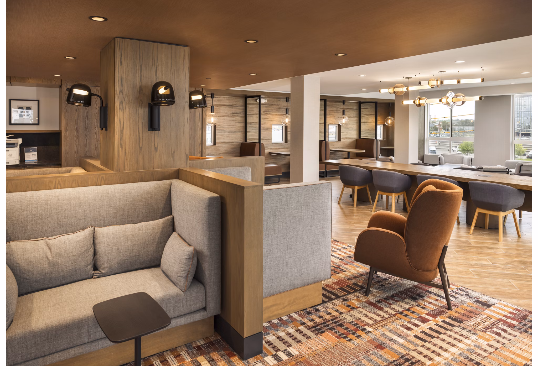 Spacious clubhouse featuring modern design and cozy seating at Forge Apartments