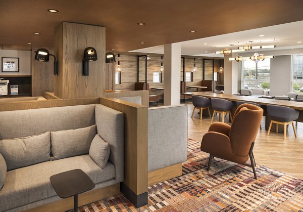 Spacious clubhouse featuring modern design and cozy seating at Forge Apartments