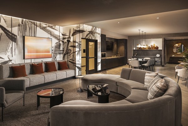 Clubhouse with modern seating and cozy fireplace at Forge Apartments, luxury living space for relaxation and socializing