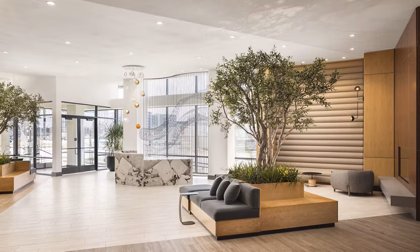 Clubhouse with modern seating and contemporary lighting at Forge Apartments, a Greystar luxury apartment community
