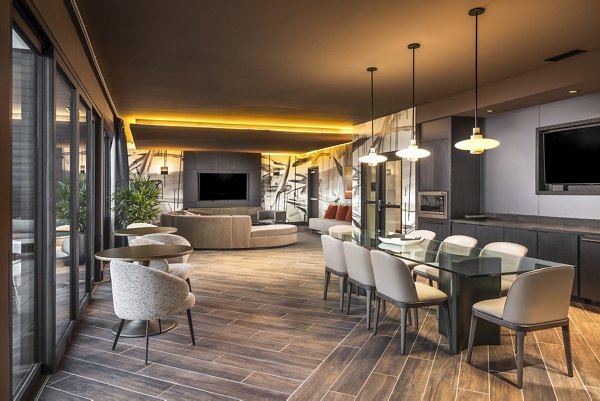 Clubhouse featuring modern design and communal seating at Forge Apartments