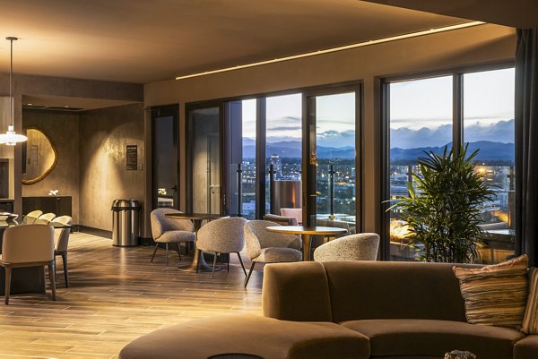 Stylish clubhouse with modern decor at Forge Apartments, offering residents a luxurious space for relaxation and socializing