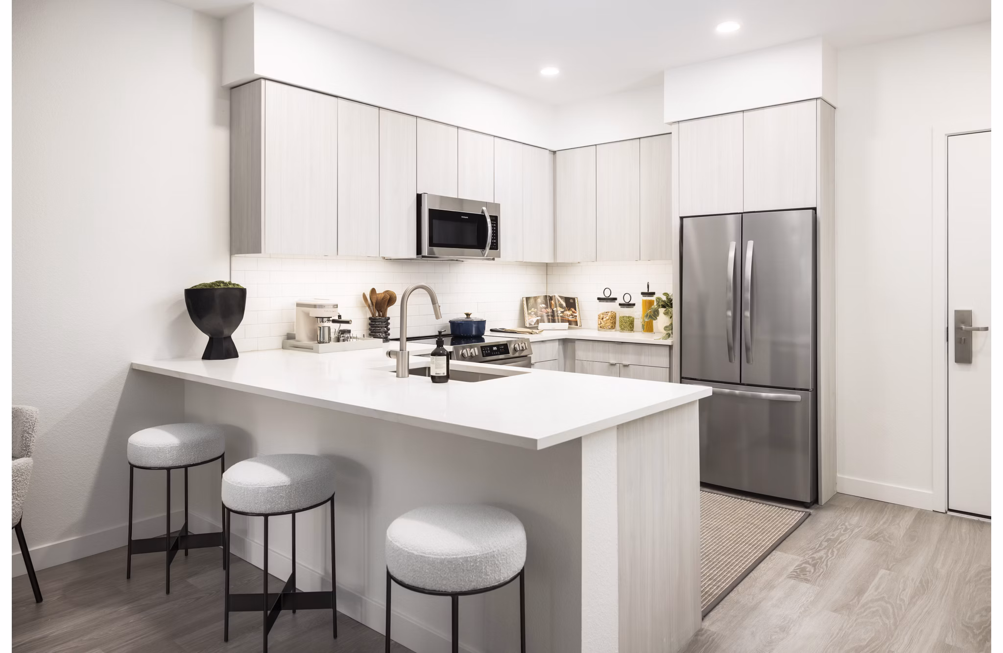 Modern kitchen with stainless steel appliances at Forge Apartments, a luxury living community