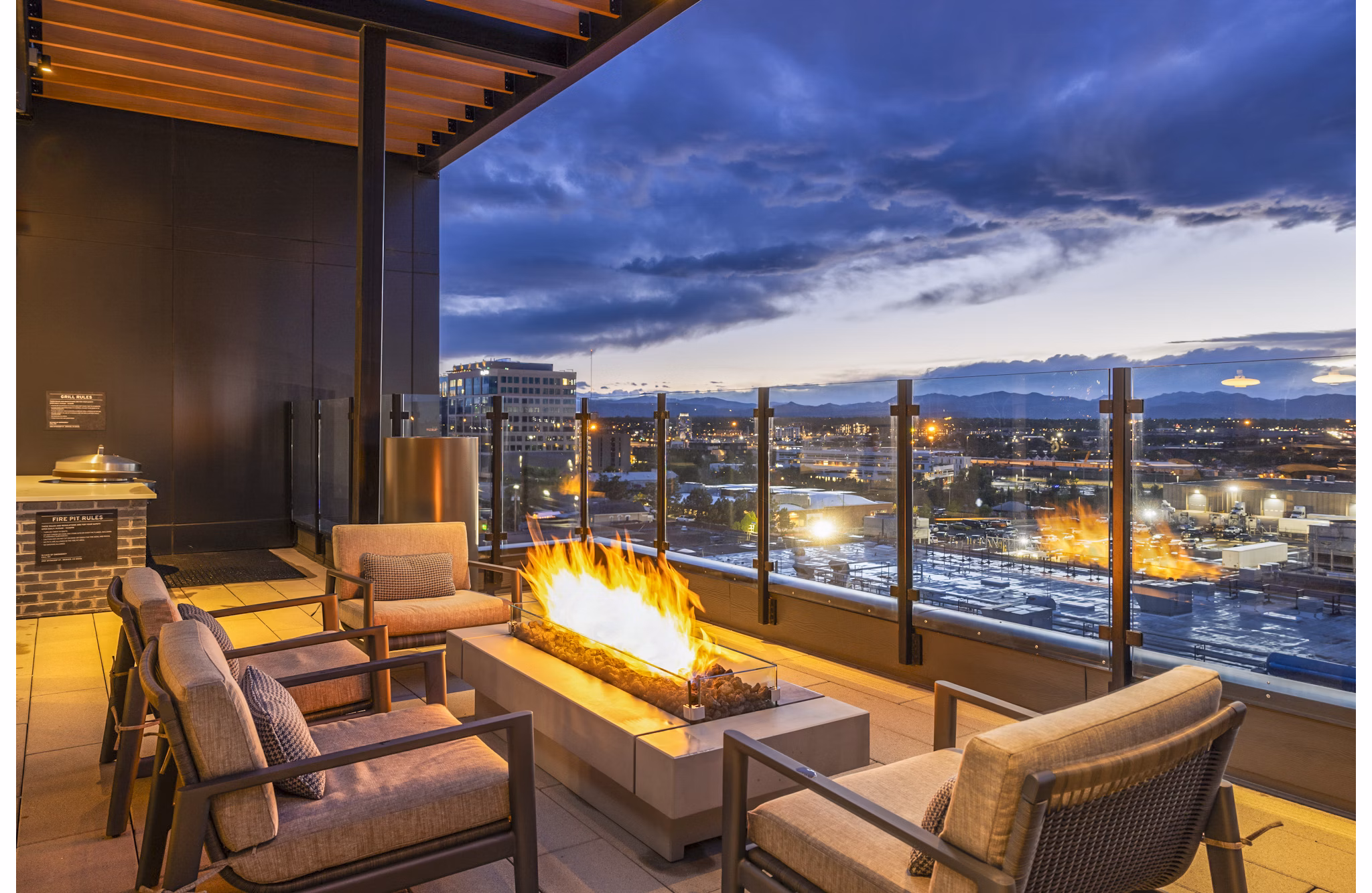 Forge Apartments: Cozy fire pit on modern outdoor patio