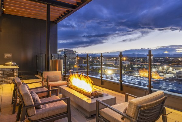 Forge Apartments: Cozy fire pit on modern outdoor patio
