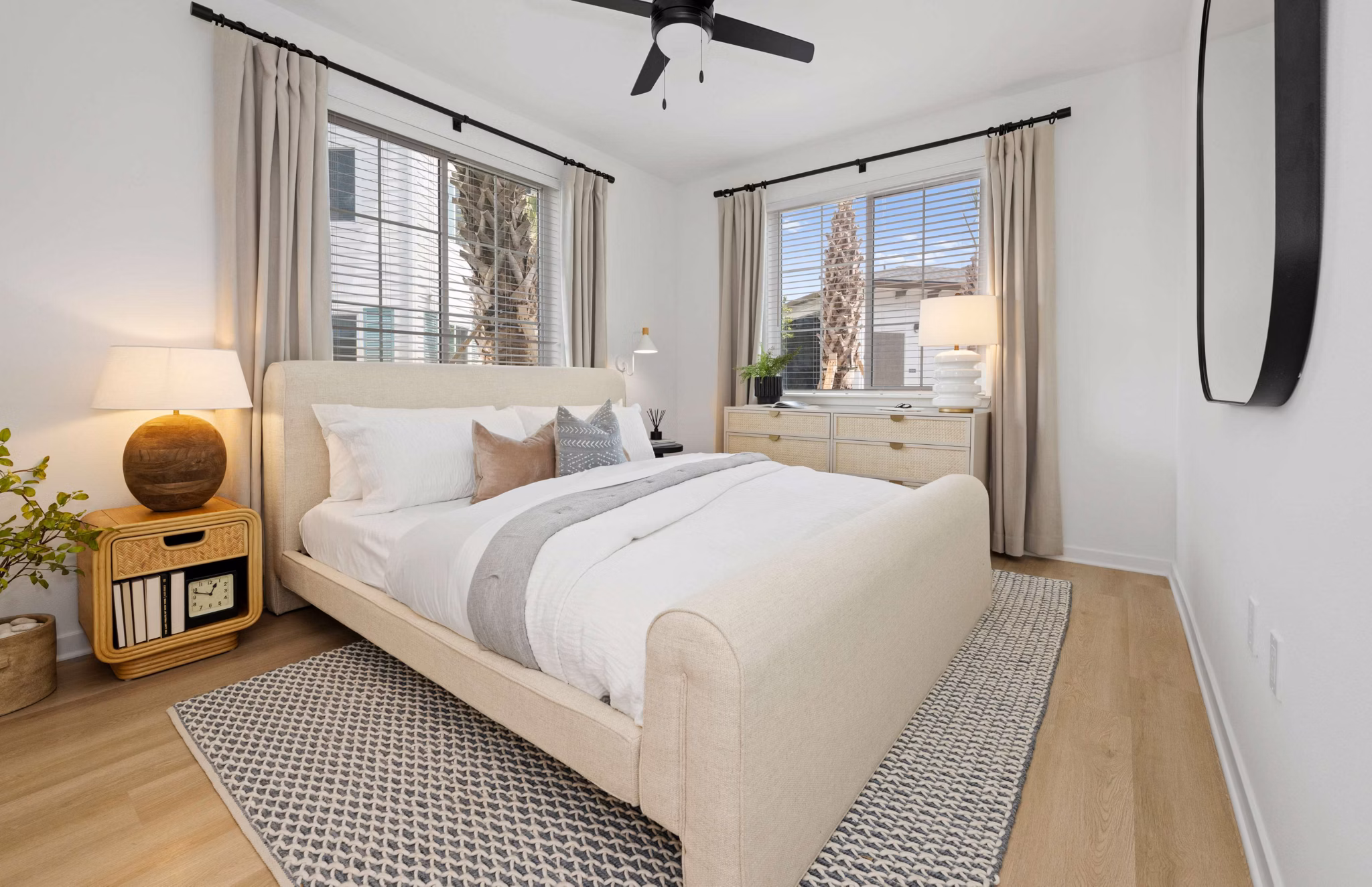 Modern bedroom with large windows at Marlowe Gateway Apartments, offering luxury living in a stylish space