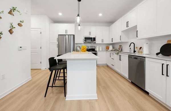 Modern kitchen with stainless steel appliances at Marlowe Gateway Apartments