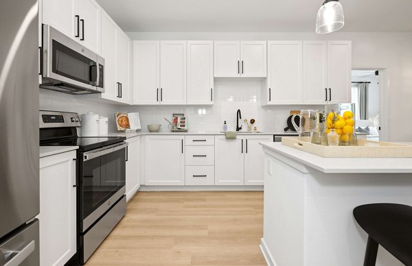 Modern kitchen featuring stainless steel appliances at Marlowe Gateway Apartments