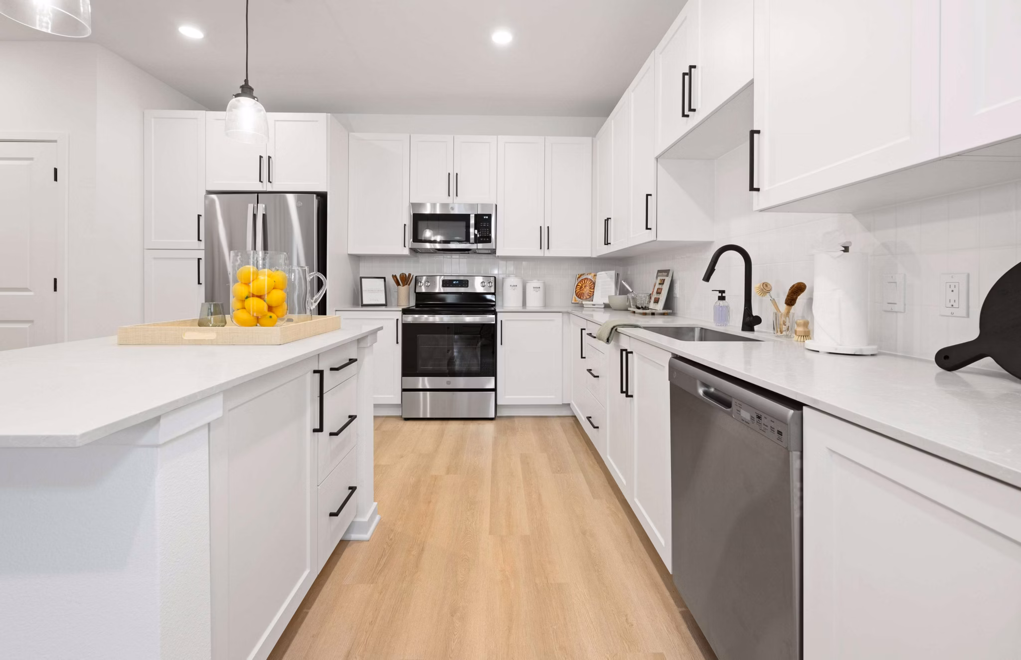 Modern kitchen with stainless steel appliances and island in Marlowe Gateway Apartments