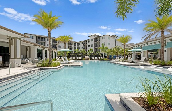 Resort-style pool with lounge chairs at Marlowe Gateway Apartments, ideal for relaxation and leisure in luxury living