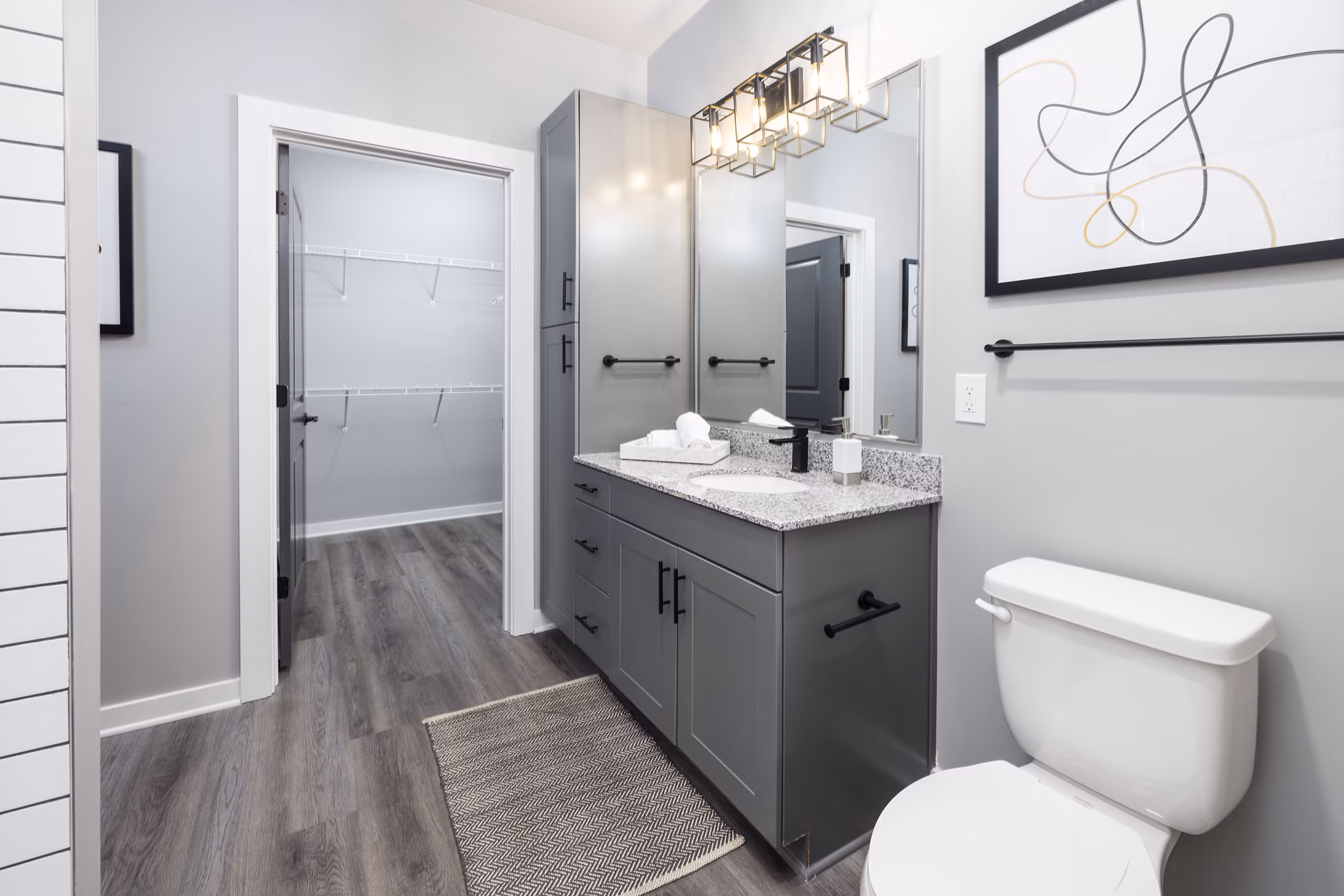 Elegant bathroom with modern fixtures at Apex Marathon Village Apartments, perfect for a luxury living experience in the heart of the city