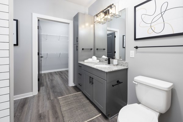 Elegant bathroom with modern fixtures at Apex Marathon Village Apartments, perfect for a luxury living experience in the heart of the city