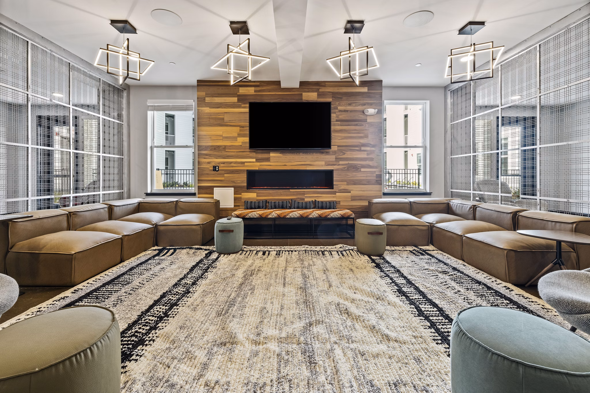 Elegant clubhouse with modern design at Apex Marathon Village Apartments, ideal for social gatherings and relaxation