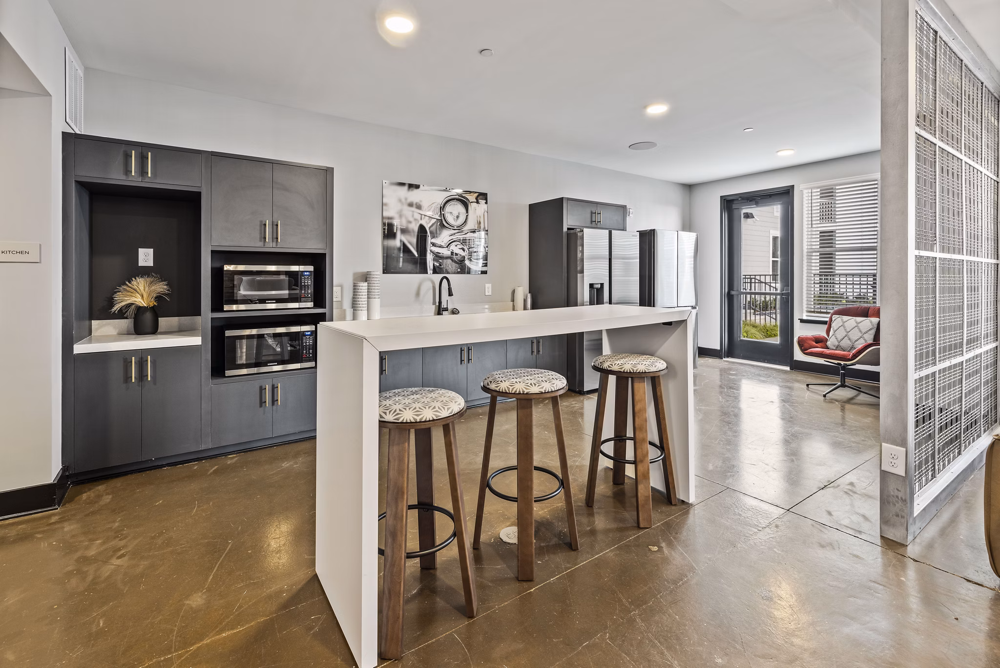 Modern clubhouse with upscale furnishings at Apex Marathon Village Apartments