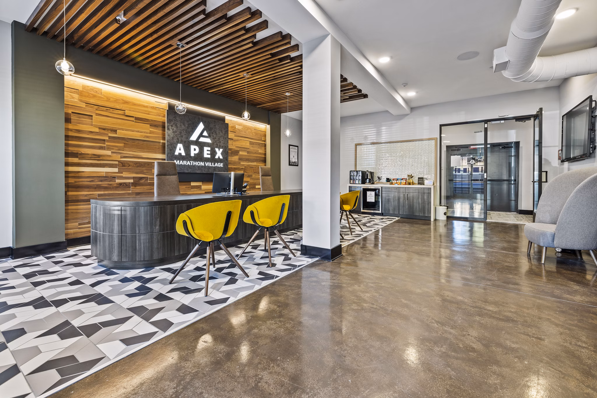 Stylish clubhouse with modern furnishings at Apex Marathon Village Apartments