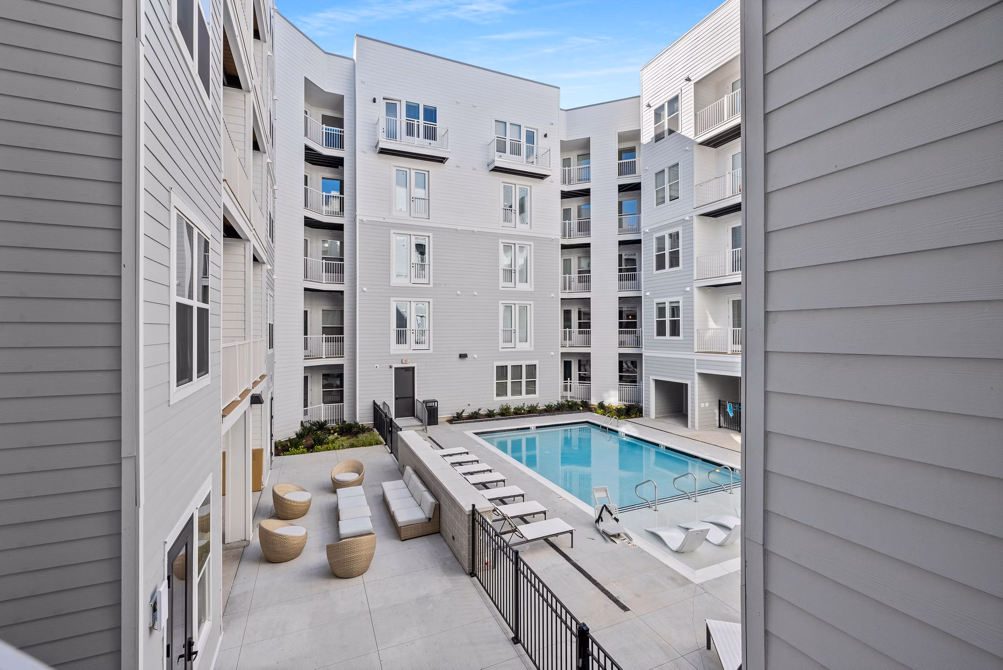 Luxurious pool area at Apex Marathon Village Apartments with sun loungers
