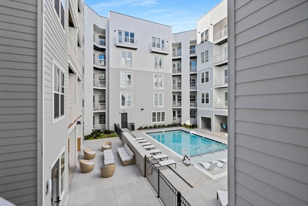 Luxurious pool area at Apex Marathon Village Apartments with sun loungers