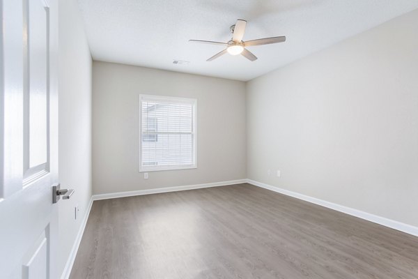 Cozy bedroom with modern furnishings at Ashton Brook Apartments