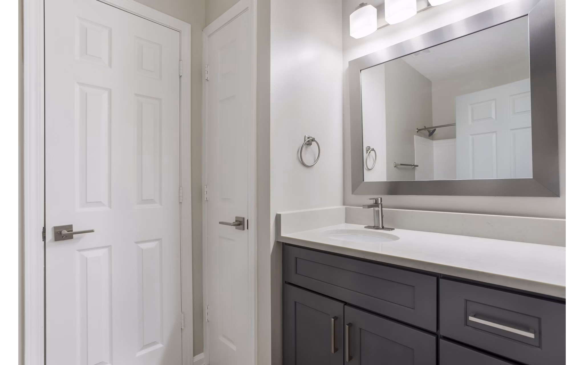 Elegant bathroom with marble countertops at Ashton Brook Apartments
