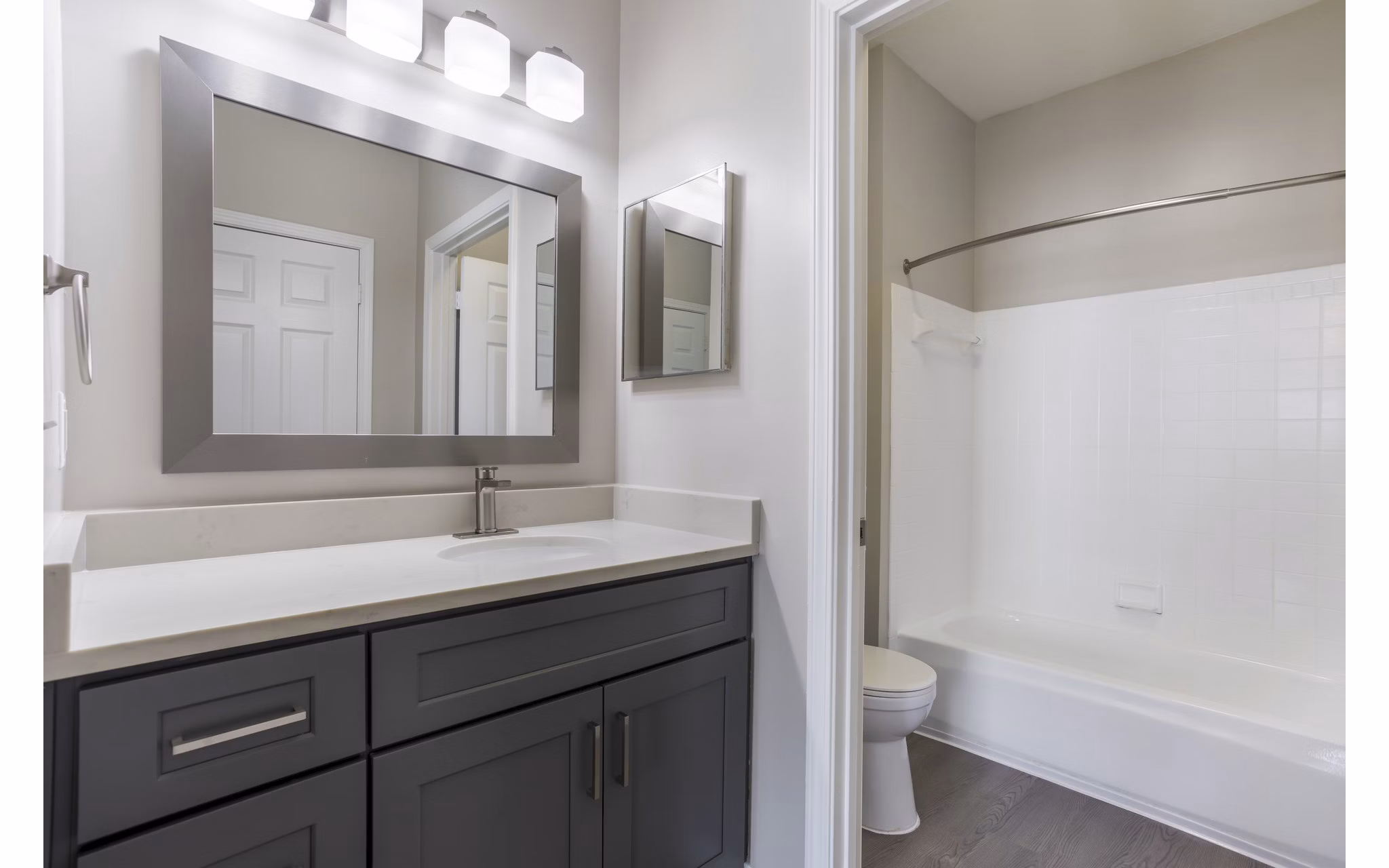 Luxury bathroom with modern fixtures at Ashton Brook Apartments, offering an elegant space for relaxation